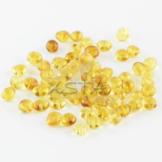Polished honey baroque amber beads 6-7 mm